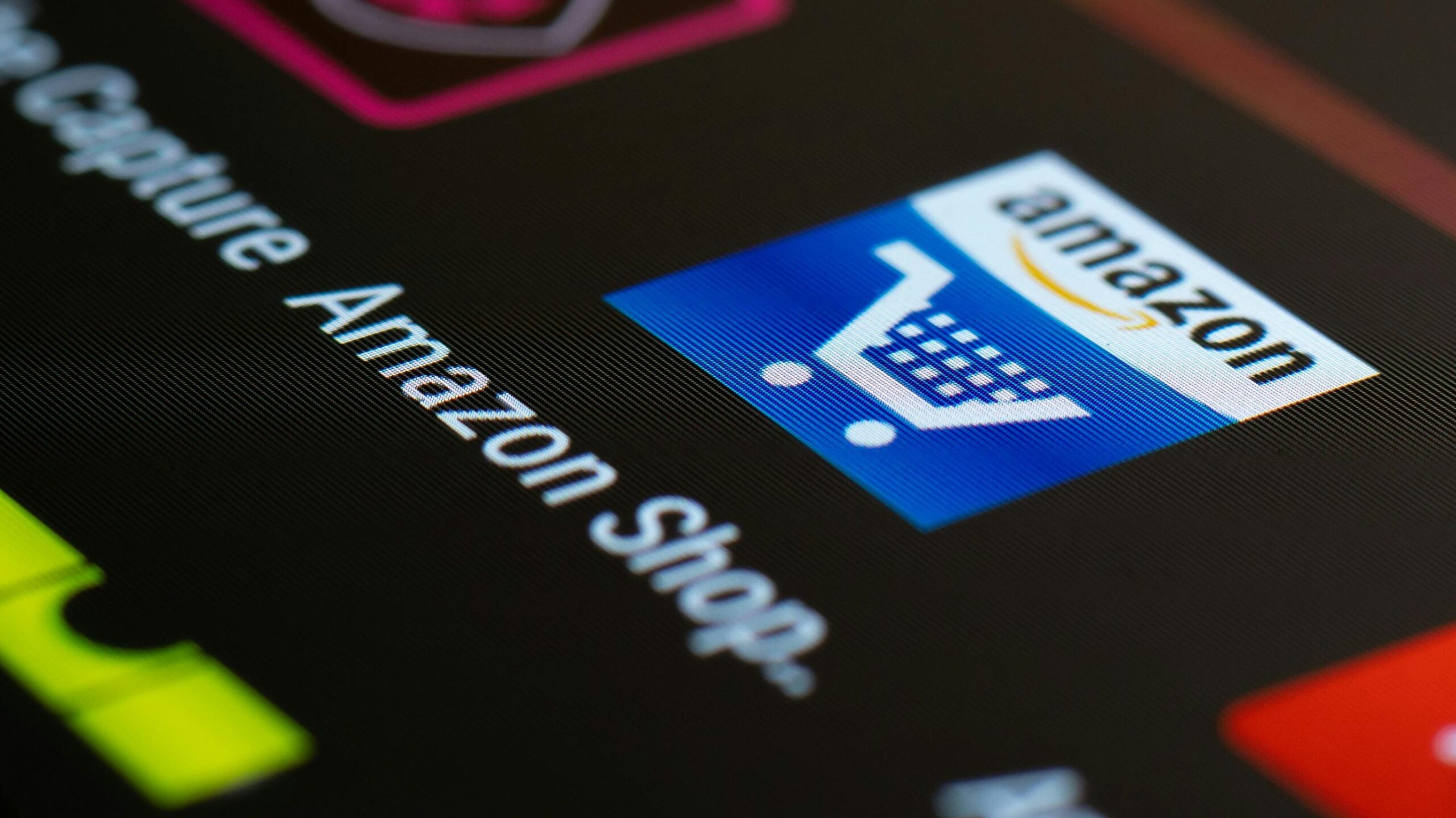 Close-up of the Amazon shopping app icon on a smartphone screen. Ideal for online shopping and technology themes.